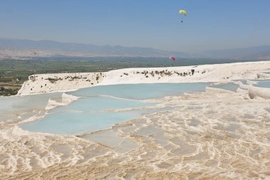Pamukkale white mineral limestone natural pool. Geology landmark in Turkey