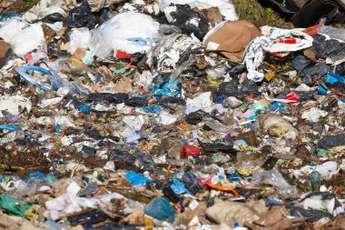 Open air garbage dump. Plastic pollution. Recycling junk. Consumerism