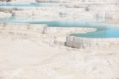 Pamukkale white mineral limestone natural pool. Geology landmark in Turkey