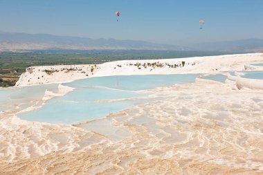 Pamukkale white mineral limestone natural pool. Geology landmark in Turkey