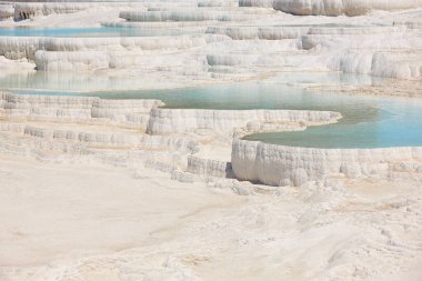 Pamukkale white mineral limestone natural pool. Geology landmark in Turkey