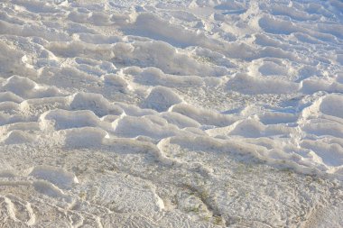 Pamukkale white mineral limestone natural pool. Geology landmark in Turkey