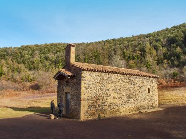 Santa Margarida chapel in La Garrotxa volcanic area. Girona, Spain          clipart