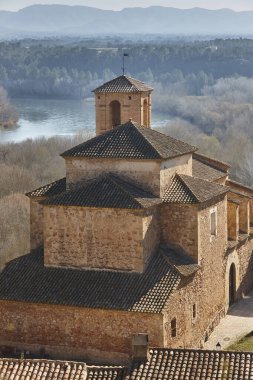 Historic stone church of Miravet. Ebro river. Tarragona. Catalunya, Spain clipart