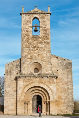 Romanesque church of St. Maria de Porqueres. Banyoles lake. Girona clipart