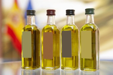 Bottles of different kinds of mediterranean spanish extra olive oil.  clipart