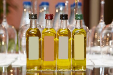 Bottles of different kinds of mediterranean spanish extra olive oil.  clipart
