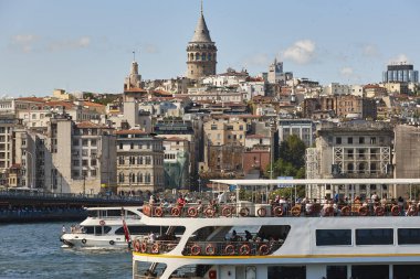 Ferry at Bosphorus strait in Istanbul. Galata tower. Turkey