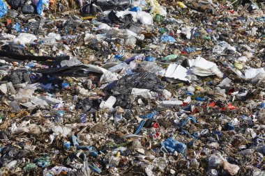 Open air garbage dump. Plastic pollution. Recycling junk. Consumerism