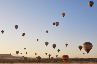 Balloons at dusk in Cappadocia. Spectacular flight in Goreme. Turkey