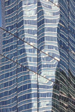 Reflexions on a skyscraper. Financial district. Five towers. Madrid, Spain clipart