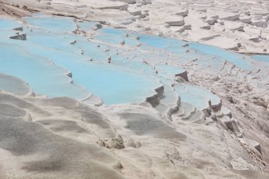 Pamukkale white mineral limestone natural pool. Geology landmark in Turkey