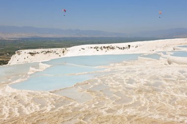 Pamukkale white mineral limestone natural pool. Geology landmark in Turkey
