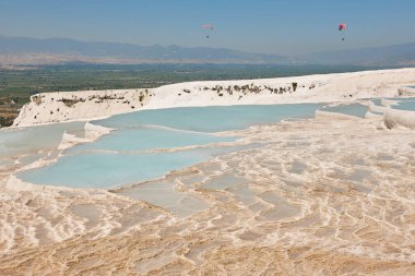 Pamukkale white mineral limestone natural pool. Geology landmark in Turkey