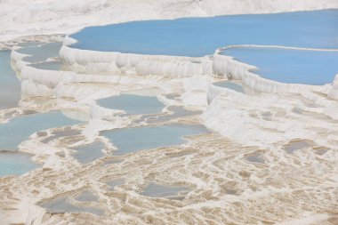Pamukkale white mineral limestone natural pool. Geology landmark in Turkey