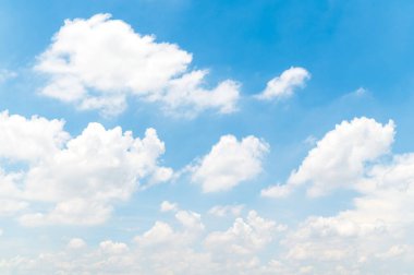 Beautiful white fluffy clouds in blue sky. Nature background from white clouds in sunny day.