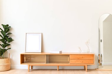 White color wall Background, minimal living room interior decor with a TV cabinet.