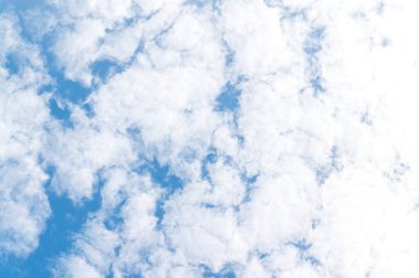 Beautiful white fluffy clouds in blue sky. Nature background from white clouds in sunny day.