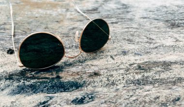 Sunglasses on wooden table summer concept