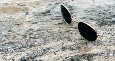 Sunglasses on wooden table summer concept