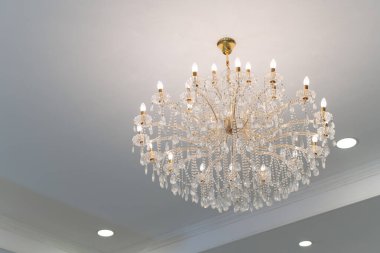 Luxury beautiful crystal chandelier in exhibition hall.