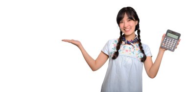 Portrait of beautiful happy young asian woman in denim dress holding calculator on white background. business shopping online concept.