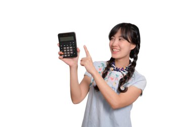 Portrait of beautiful happy young asian woman in denim dress holding calculator on white background. business shopping online concept.