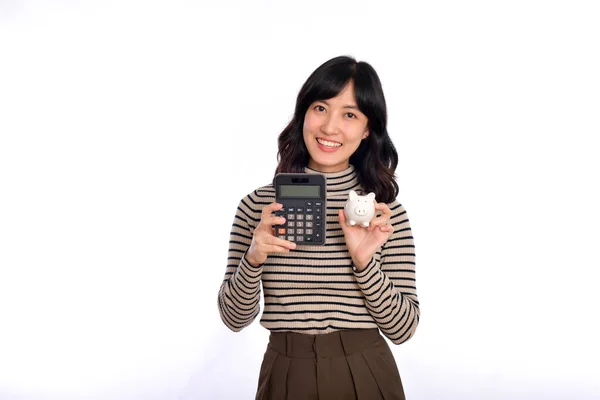 Portrait Young Asian Woman Holding White Piggy Bank Calculator Isolated — Stok fotoğraf