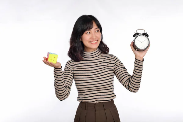 Asian Woman Holding Alarm Clock Puzzle Cube Standing White Background — Stock Photo, Image
