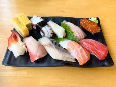 The premium sushi set place on black plate