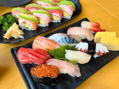 The premium sushi set place on black plate