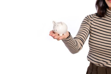 Portrait of young Asian woman holding white piggy bank isolated on white background, Financial and bank saving money concept
