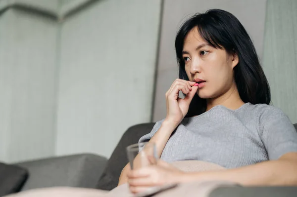 Asian Young Woman Take Medicine Pill While Laying Sofa — Stock Photo, Image