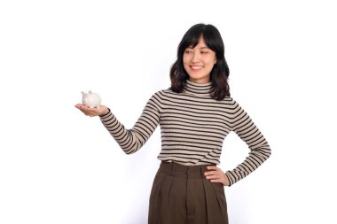 Portrait of young Asian woman holding white piggy bank isolated on white background, Financial and bank saving money concept