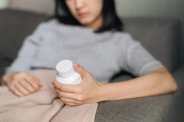 Asian Woman Cold Flu Reading Instructions Medicine Bottle — 스톡 사진