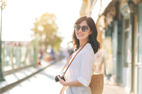 stock image Portrait of young beautiful woman with camera explore street in Bangkok, Thailand