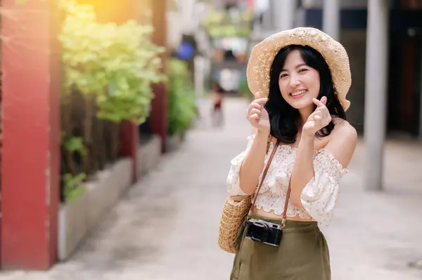 stock image Happy asian youth woman with camera travels street city trip on leisure weekend. Young hipster female tourist sightseeing summer urban Bangkok destination. Asia summer tourism concept.