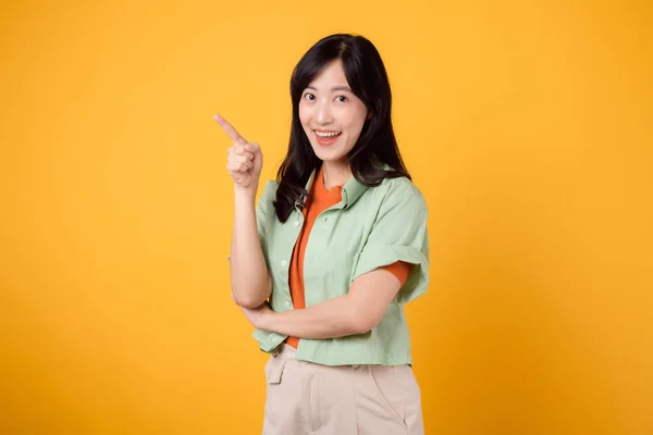 Portrait Joyful Asian Young Woman Model Showing Pointing Finger Gesture — Stock Photo, Image