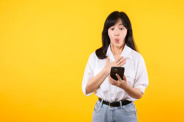 Surprised Asian Young Woman Using Mobile Phone Positive Expression Smiles — Stock Photo, Image
