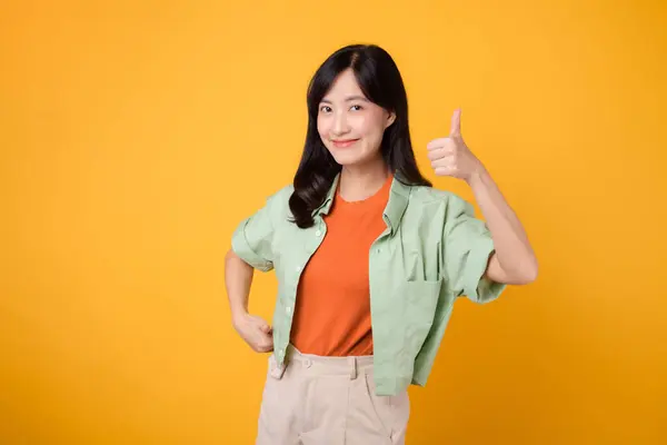 Embodying Confidence 30S Cheerful Asian Woman Wearing Green Orange Shirt — Stock Photo, Image