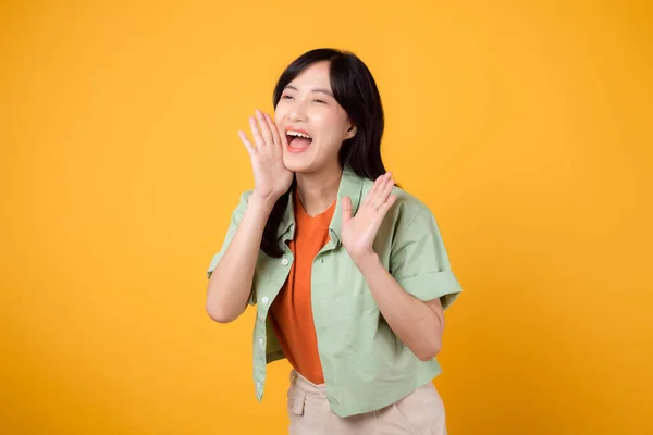 Energetic Young Asian Woman 30S Wearing Green Shirt Orange Background — Stock Photo, Image