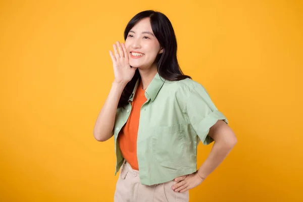 Energetic Young 30S Asian Woman Wearing Green Shirt Orange Background — Stock Photo, Image