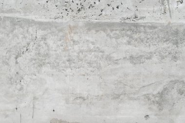 Gri beton duvar dokusu soğuk endüstriyel arka plan sağlar. Modern ev yenileme projesi için mükemmel boş tuval yüzeyi basit ama güçlü bir estetik yaratıyor.