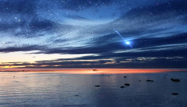 night blue sky on sunset at sea water reflection gold sun beam and starry sky star fall  flares  sun down blue pink orange  nature landscape