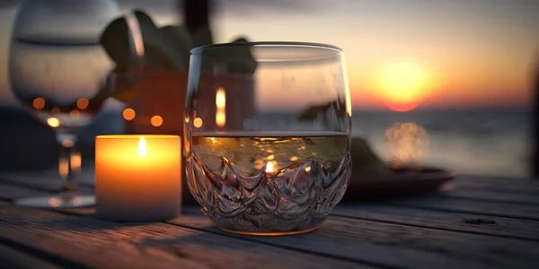 Sunset city evening street cafe glass of orange wine and candles on wooden table ,houses and blurred light