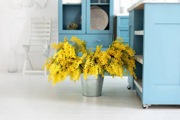 Spring flowers Mimosa in vase. Branches yellow flowers in a bouquet. Beautiful yellow spring flowers. 8 March, Easter, Mother\'s day. Branches yellow flowers in a bouquet. Gardening concept.