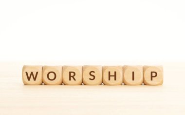 Worship word on wooden blocks. Copy space