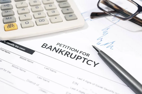 Bankruptcy Form Calculator Pen Desk Personal Injury Claim Form — Stock Photo, Image