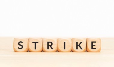 Strike word on wooden blocks. Copy space clipart