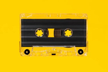 Blank Vintage audio cassette isolated on yellow background. Template mock up clipart